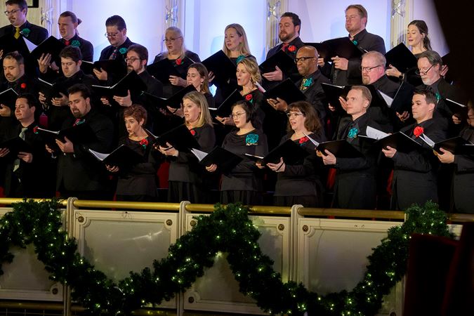 Closeup of the Chicago Symphony Chorus singing carols with the CSO from the Terrace