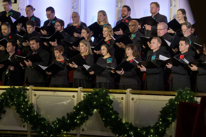 Closeup of the Chicago Symphony Chorus singing carols with the CSO from the Terrace