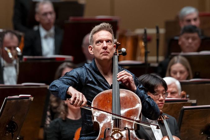 Johannes Moser focuses while playing the Lutosławski Cello Concerto