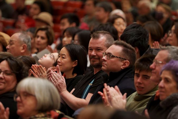 Audience members applauding on the Main Floor at the 2025 Young Artists Competition