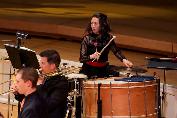 Closeup action shot of CSO principal percussion Cynthia Yeh performing on stage