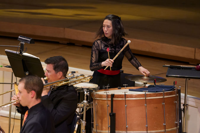 Closeup action shot of CSO principal percussion Cynthia Yeh performing on stage