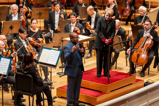 composer speaking from stage