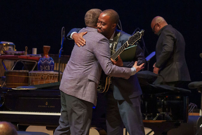 Benny Green and Dan Wilson embrace on stage after their opening set