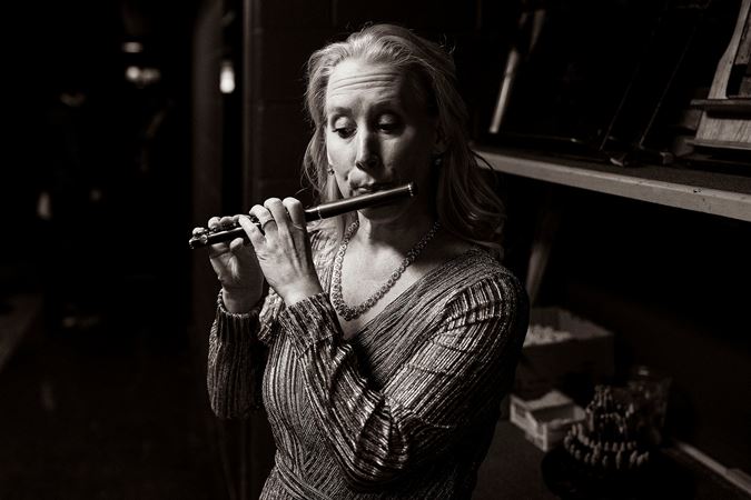 Jennifer Gunn warms up on piccolo backstage