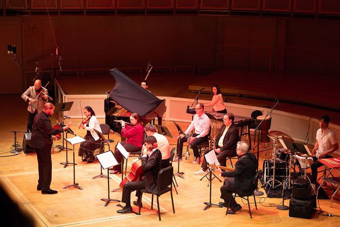 the ensemble performs Roumain's Voodoo Violin Concerto