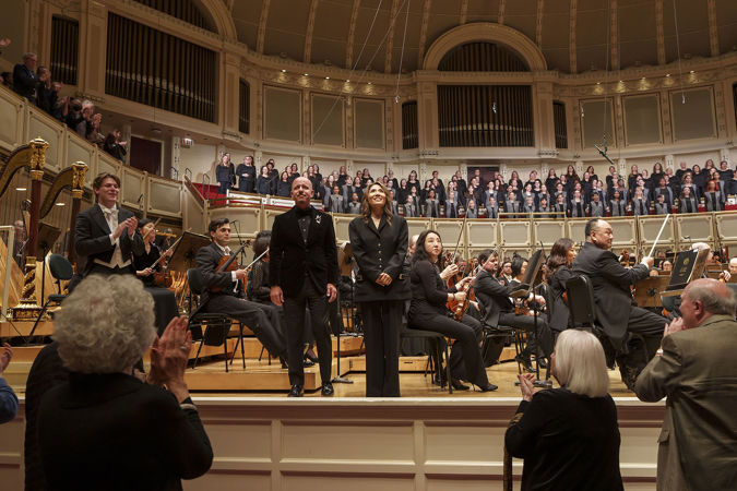 Guest Chorus Director James Bass and Artistic Director of Uniting Voices Chicago Josephine Lee bowing on stage