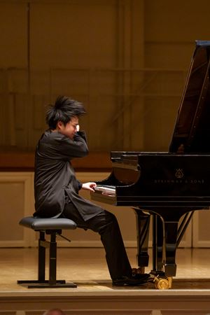 Action shot of Mao Fujita playing the piano
