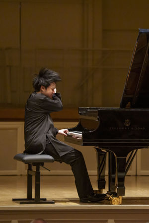 Action shot of Mao Fujita playing the piano