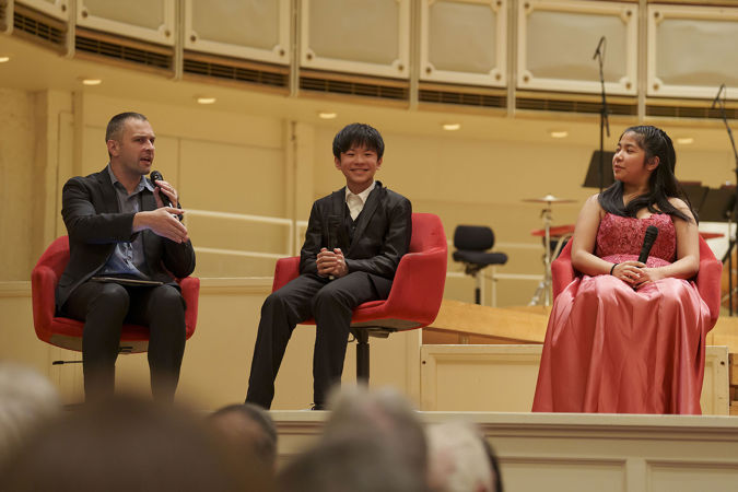 WFMT's Robbie Ellis asking a question to the four 2025 Young Artists Competition finalists at a postconcert Q&A session