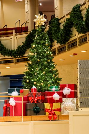 Closeup shot of a Christmas tree and presents on stage