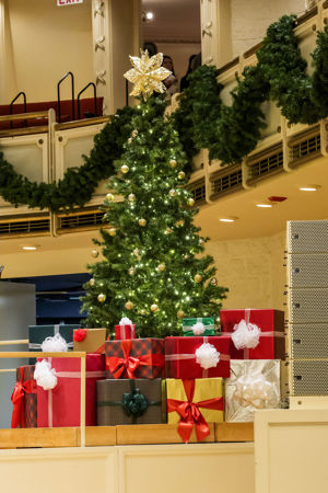 Closeup shot of a Christmas tree and presents on stage