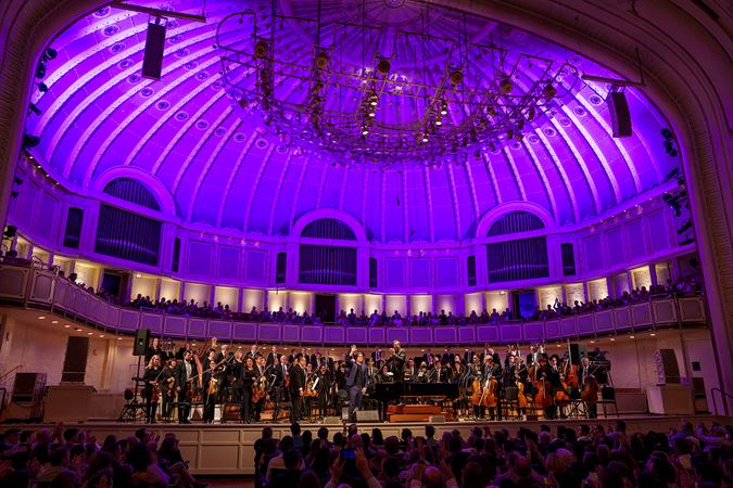 Wide bow shot of the CSO, singer-songwriter Ben Folds and conductor Steven Reineke