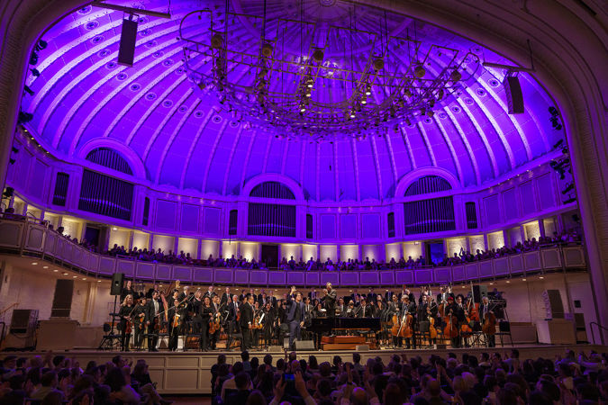 Wide bow shot of the CSO, singer-songwriter Ben Folds and conductor Steven Reineke