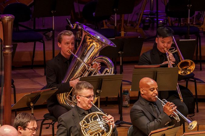Closeup of Civic tuba Ben Poirot and trombone Dustin Nguyen