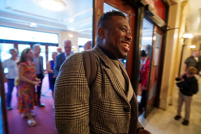 A happy patron enters Symphony Center en route to Orchestra Hall