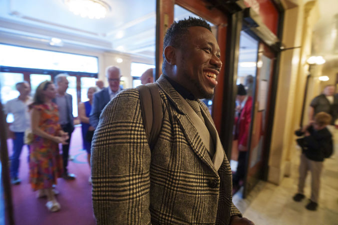 A happy patron enters Symphony Center en route to Orchestra Hall