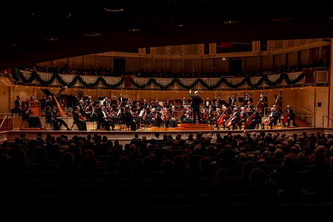 a wide shot of the Orchestra and audience during the cello concerto