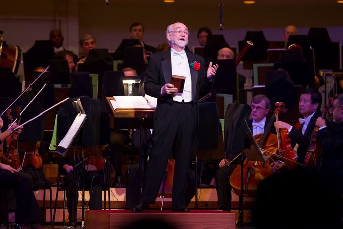 Duain Wolfe at the podium of "Welcome Yule!" performance in December 2012