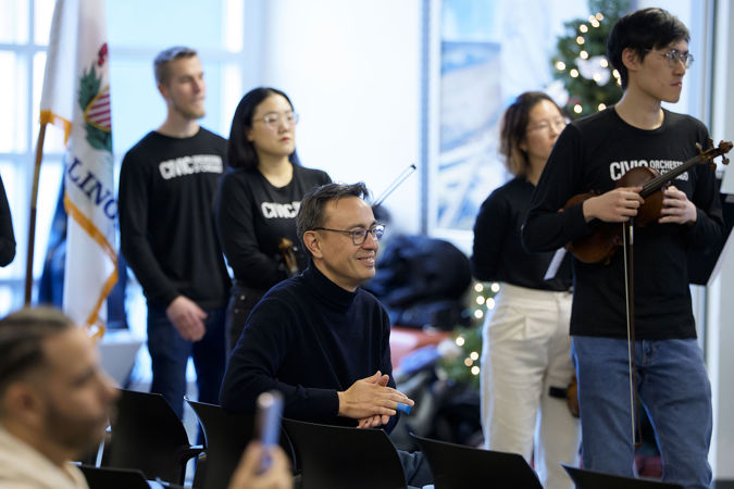 Civic Principal Conductor Ken-David Masur applauding the UCAN Inspire Choir before the Civic musicians present their Bach program to listeners