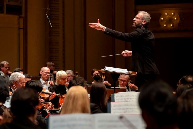 conductor Dima Slobodeniouk gestures on the podium