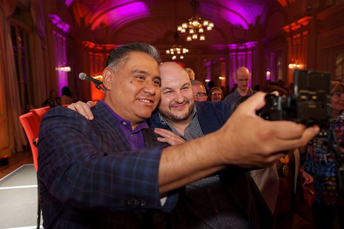 CSO principal trumpet Esteban Batallán takes a photo with a Latino Alliance member