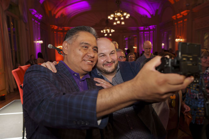 CSO principal trumpet Esteban Batallán takes a photo with a Latino Alliance member