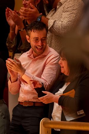 audience members clapping