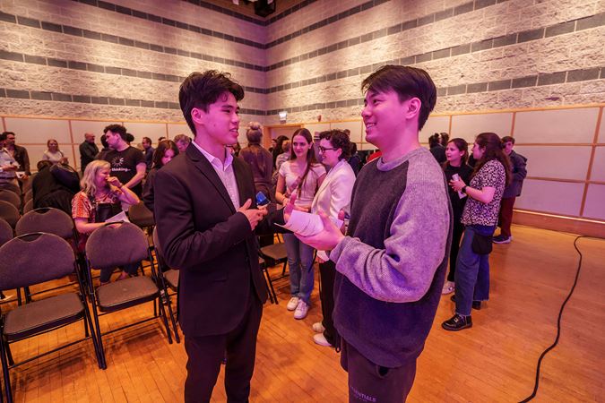 composer mingling with audience