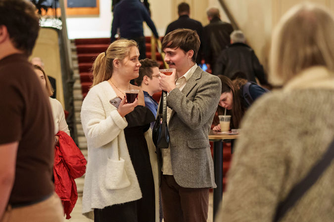 Audience members in lobby
