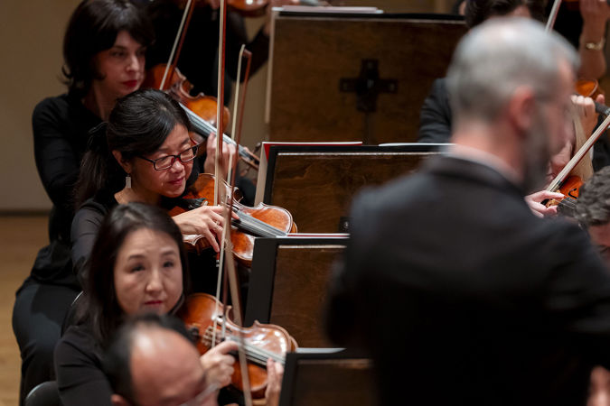 members of the CSO violin section performing