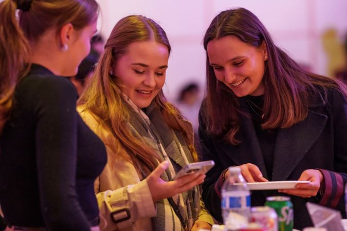 college night students on phone