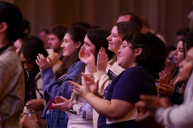Audience members applauding on the Main Floor