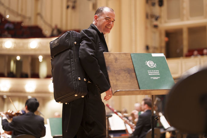 Closeup shot of CSO bassoon William Buchman walking on stage to warm up