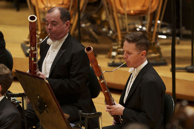 Closeup of two CSO bassoon players, Miles Maner and William Buchman