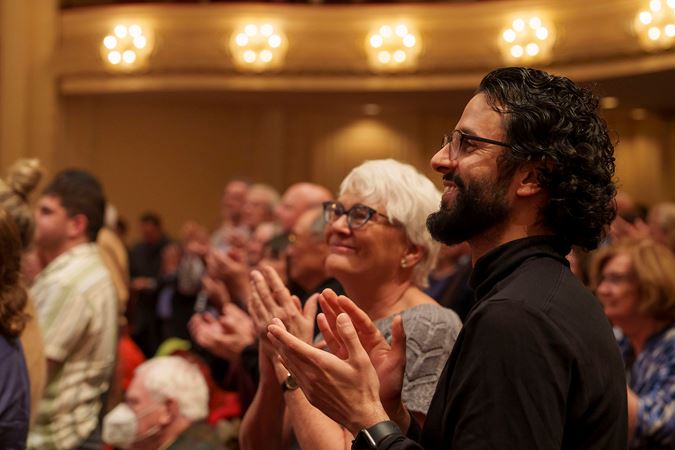 Patrons applauding on the Main Floor