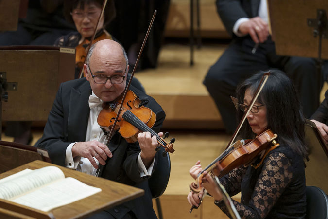 Close up of CSO violins Baird Dodge and Qing Hou