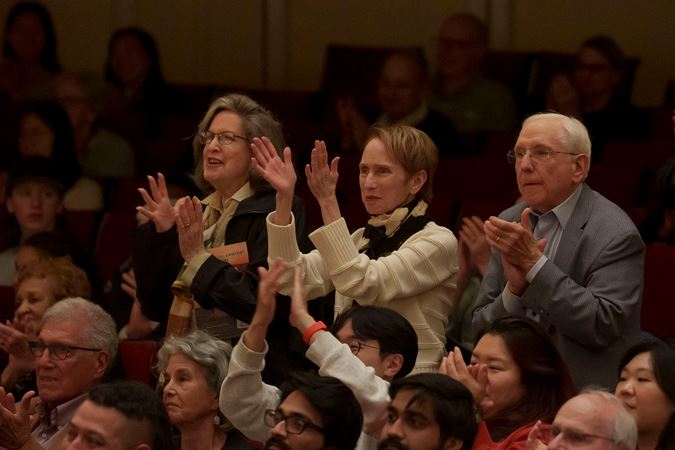 audience members clapping