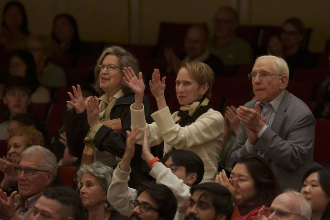 audience members clapping