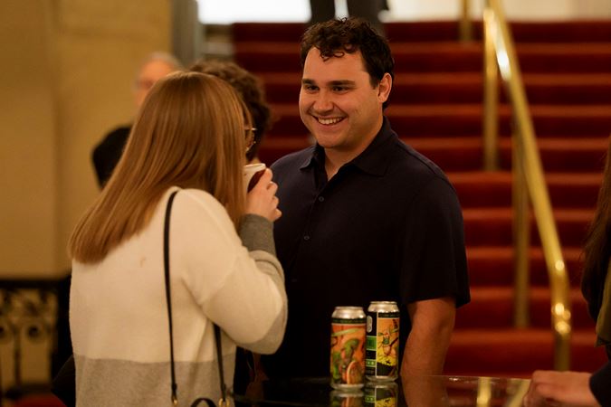 Audience members socializing on the Main Floor near concessions
