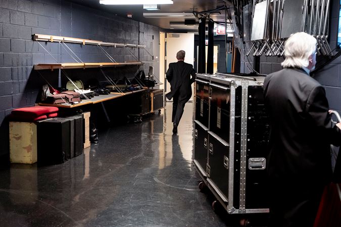 musician running backstage