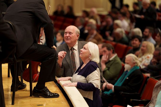 Patrons speaking with CSO concertmaster Robert Chen before the performance