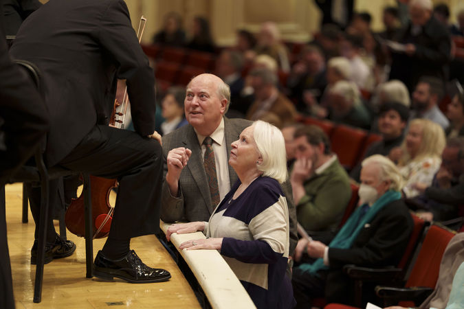 Patrons speaking with CSO concertmaster Robert Chen before the performance