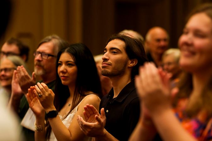 the audience gives Jennifer Gunn a standing ovation