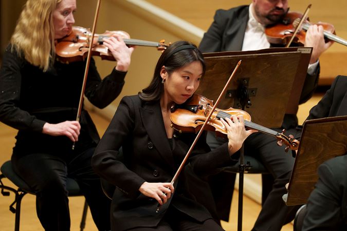 CSO violinist So Young Bae concentrates on the music