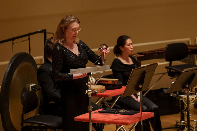 Percussionist playing triangle
