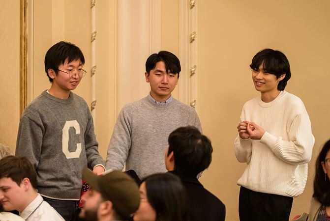 Patrons chatting together on the main floor during intermission
