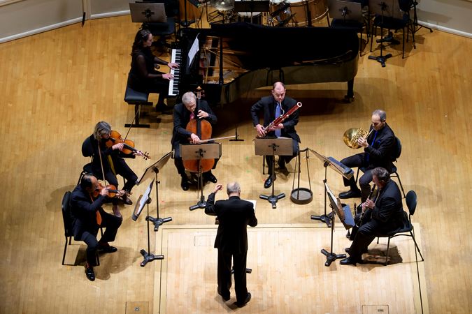 Action shot of Stefan Asbury conducting a CSO septet
