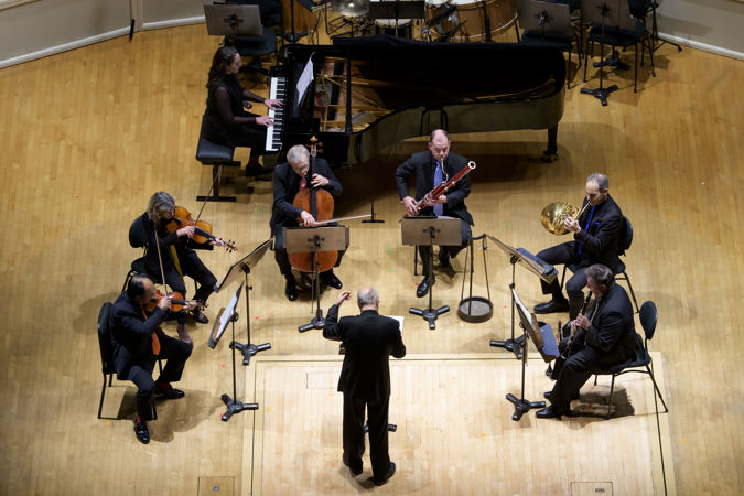 Action shot of Stefan Asbury conducting a CSO septet
