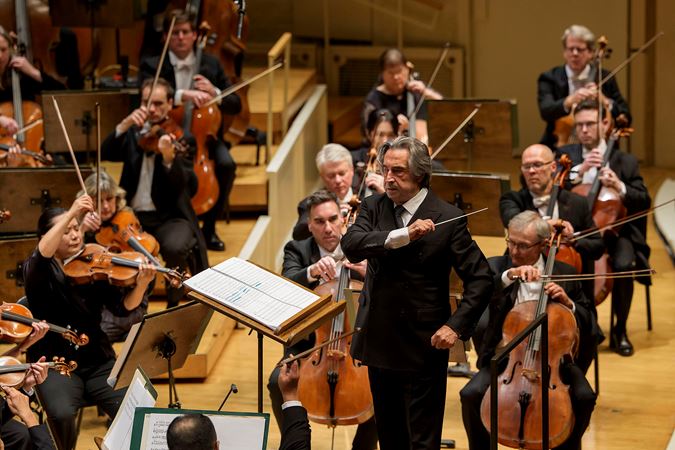 Music Director Emeritus for Life Riccardo Muti swipes his baton across his left arm in a gesture to the violins